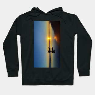 A silhouetted horse-drawn carriage on Parangtritis beach at sunset 2v Hoodie